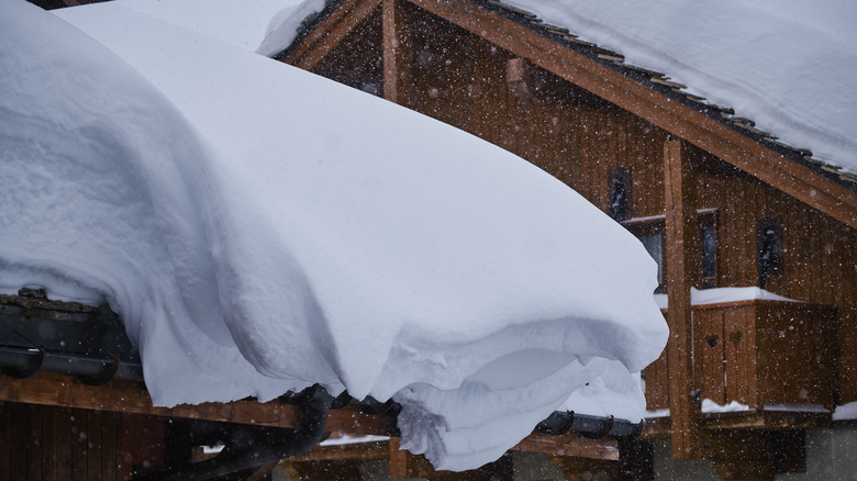 Snow overhanging roof and gutters