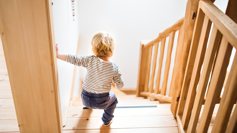child walking down stairs