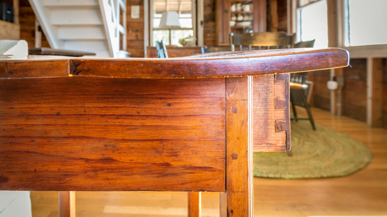 Antique wood table with dovetail joints on the drawer