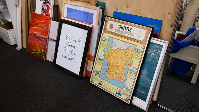 Framed artwork in a thrift store