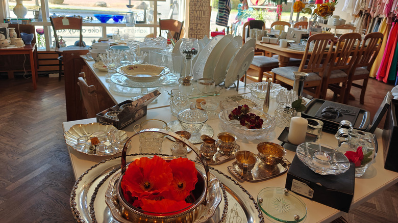 Glassware on a table in a thrift store