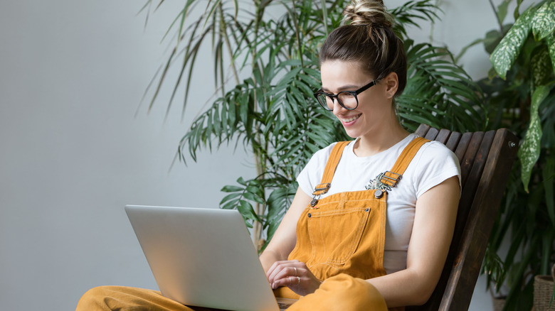 Woman shopping online for plants