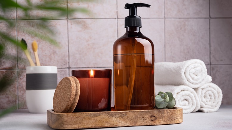 Lit candle in bathroom