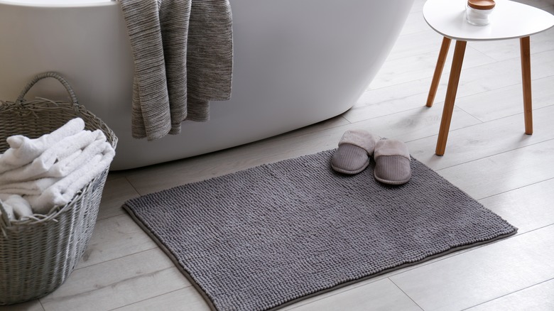 Slippers on bath mat