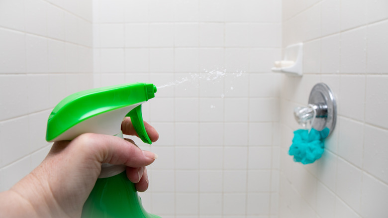 spraying product in shower