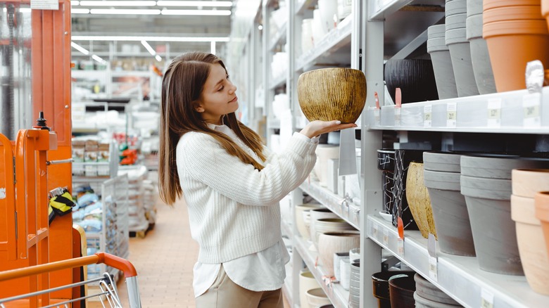 Person choosing pots