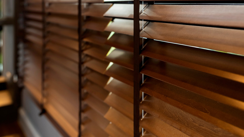 Close-up of wooden blinds on windows