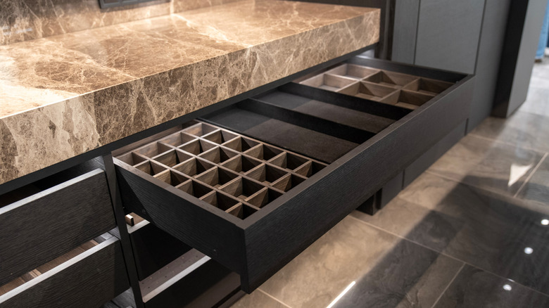 A wooden kitchen drawer with highly-customized internal storage