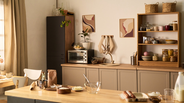 A modern but cozy kitchen with freestanding storage on the kitchen counter