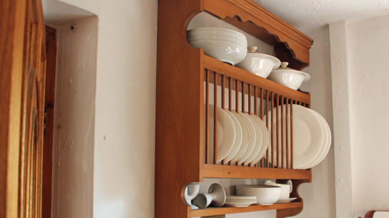 wooden plate rack on kitchen wall