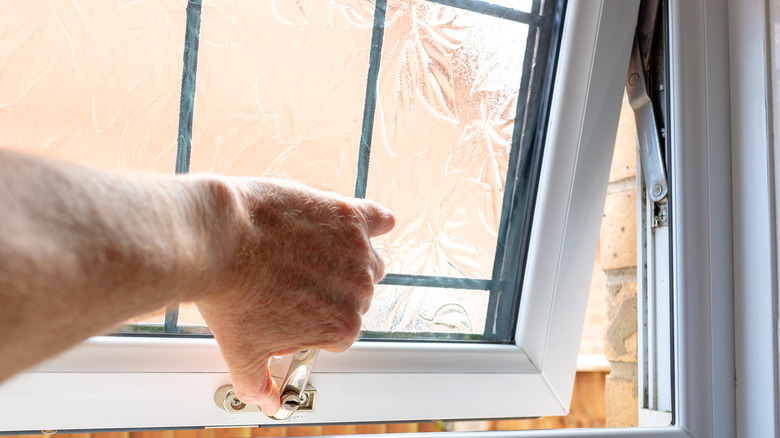 Person opening window
