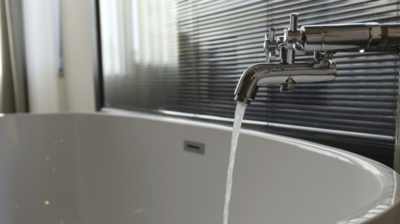 Tub tap pouring water