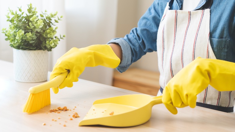 Housekeeper cleaning crumbs