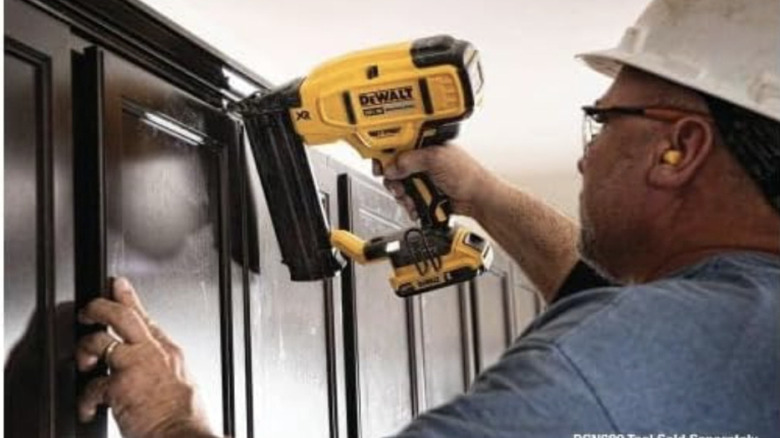 worker using oscillating tool kit