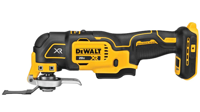 A person using an oscillating multi-tool
