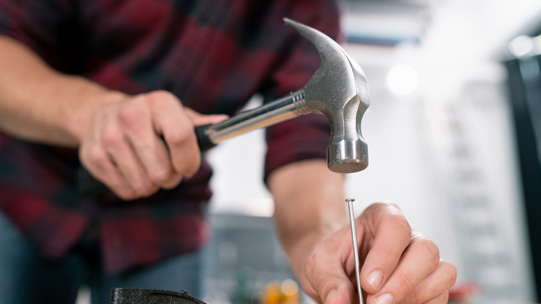 Man hammering a nail