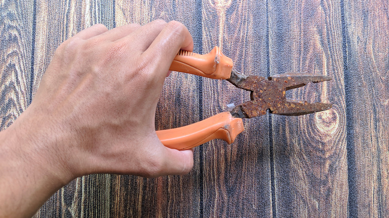 A person using pliers