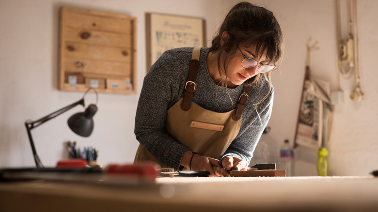 Woman works on carpentry project