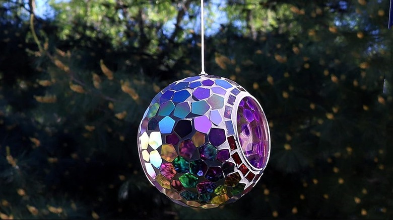 Sunnydaze Glass Mosaic Bird Feeder hanging in yard