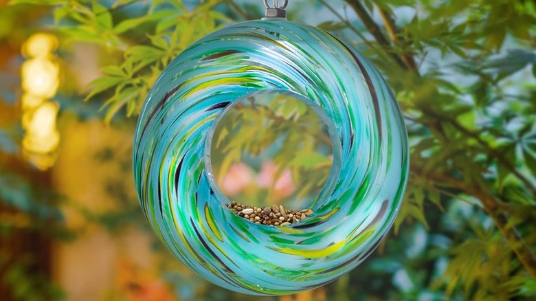 Yinns Glass Fly-Through Bird Feeder hanging from tree