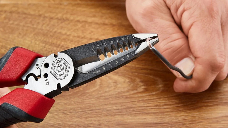 Close-up of a worker using Doyle's Electrician's Multipurpose Pliers
