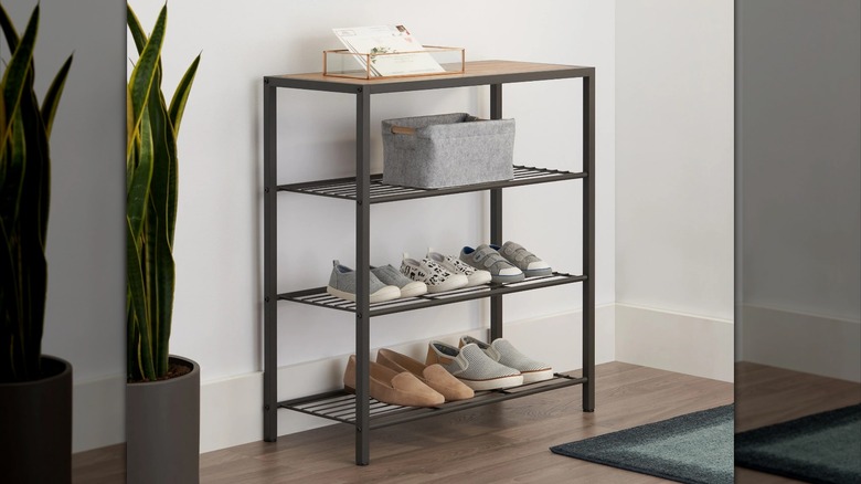 Trinity 4-tier Shoe Rack with Console Top in entryway loaded with shoes, a basket, and a storage bin for mail