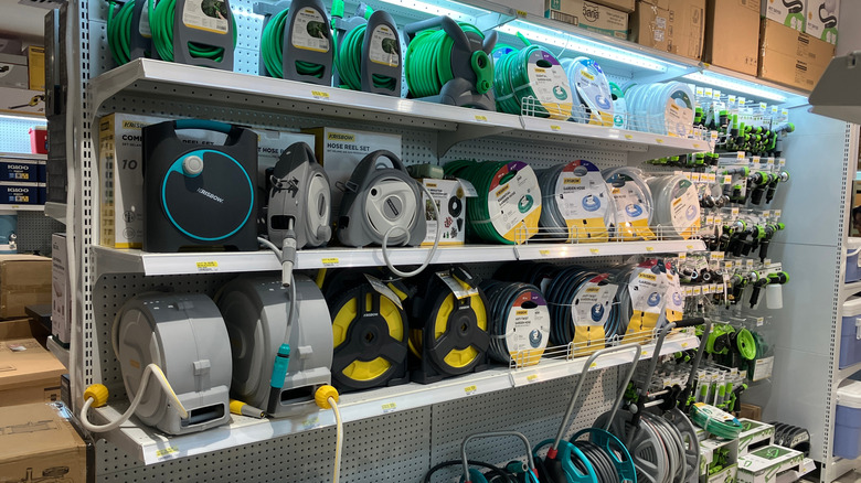 Shelves of hoses and nozzles in a store