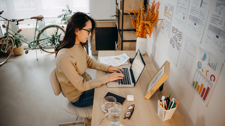 Woman works at home office