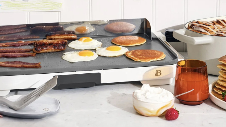 Griddle with breakfast items on a counter