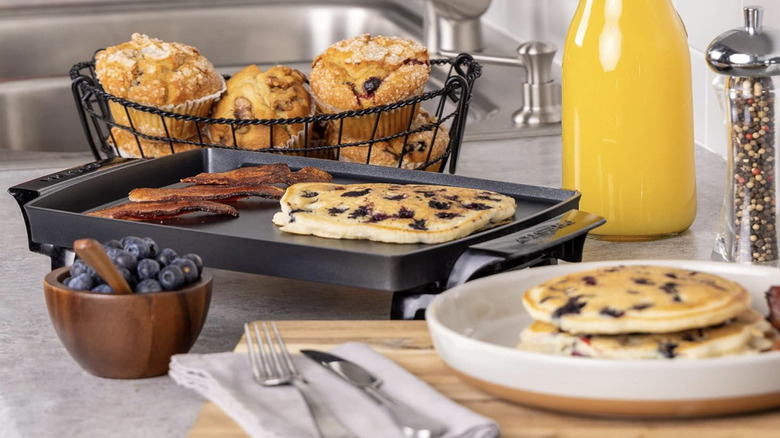 Mini Presto griddle on a counter with breakfast items
