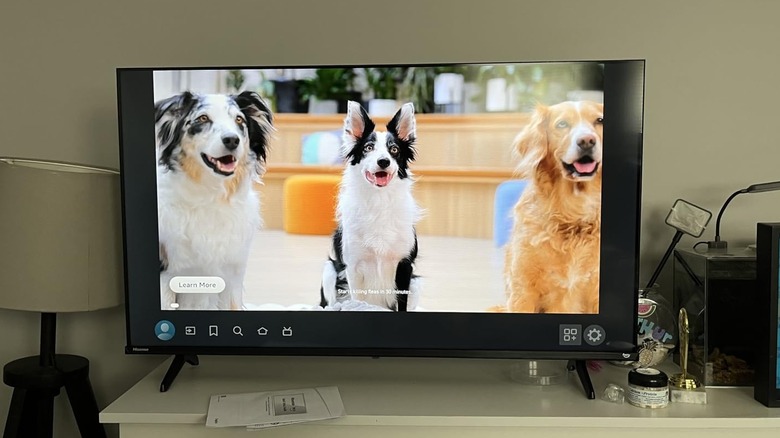 Hisense's Class QD4 Series Hi-QLED FHD Smart Fire TV on a dresser