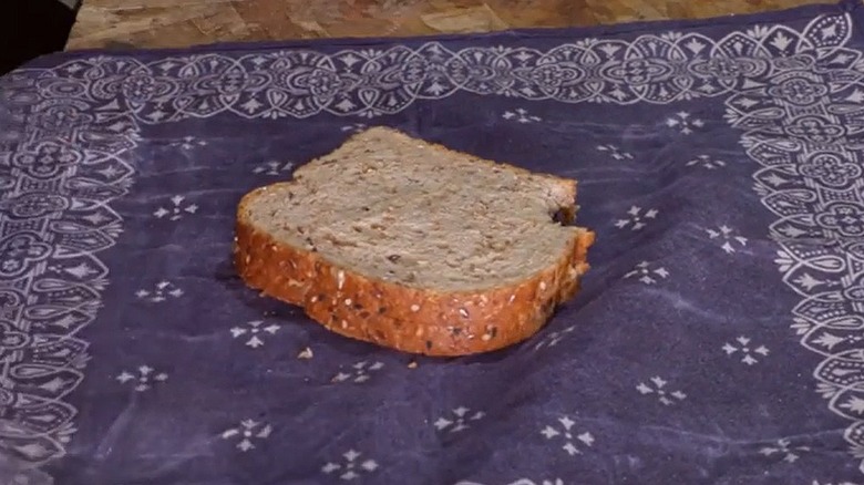 A sandwich sits on a home-made beeswax wrap made from a bandana