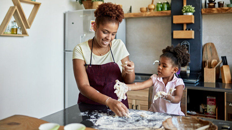 Mom and daughter messy cooking