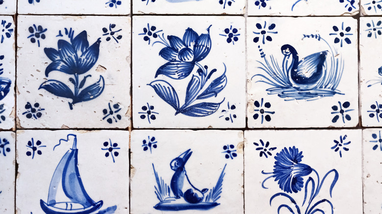 A close up on rows of Delft style tiles.