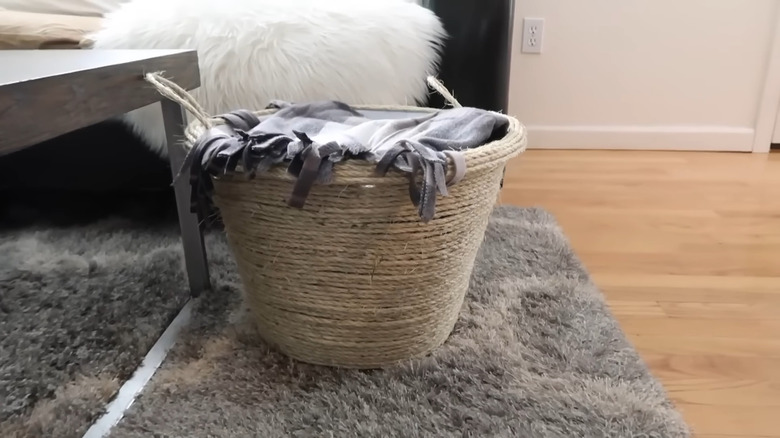 YouTuber making a rope basket with a Dollar Tree hamper