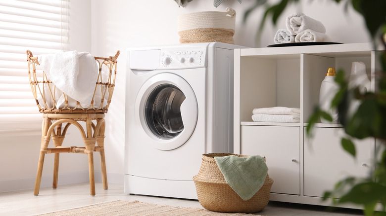 Laundry room with woven basket in it