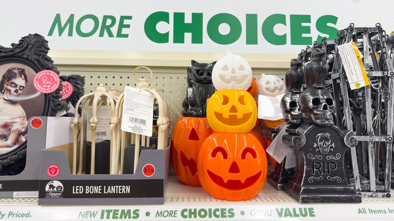 A shelf in Dollar Tree displays Halloween decorations.