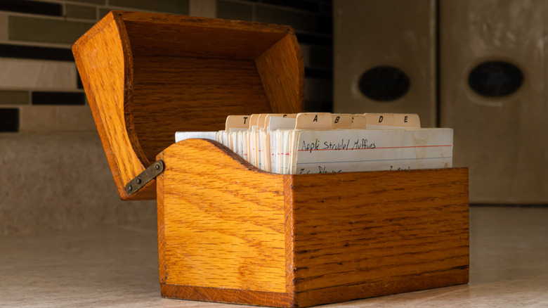 Wooden recipe box with recipe cards inside