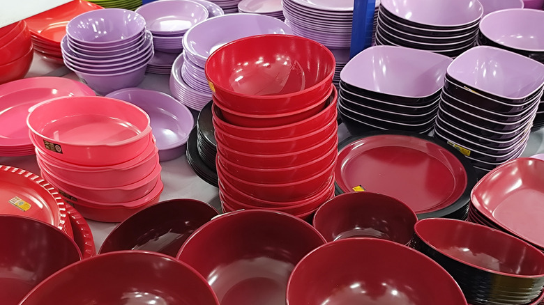Stacks of round plastic bowls in a shop suitable to make a lamp