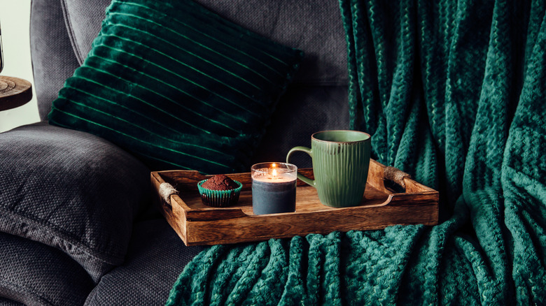 Wooden serving tray on top of couch