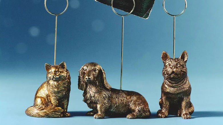 Anthropologie ragdoll cat, weiner dog, and bulldog figurine photo holders in gold