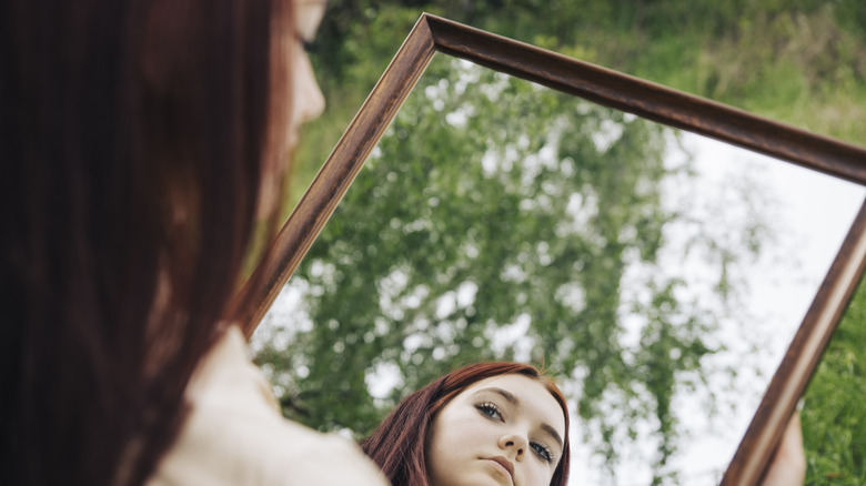 Someone holding a mirror