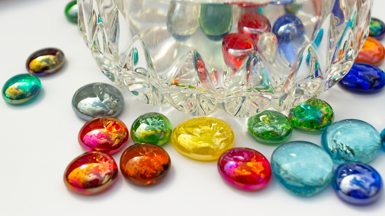 Colorful accent glass gems on table.