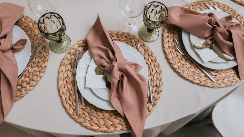 Dining table set with natural woven placemats