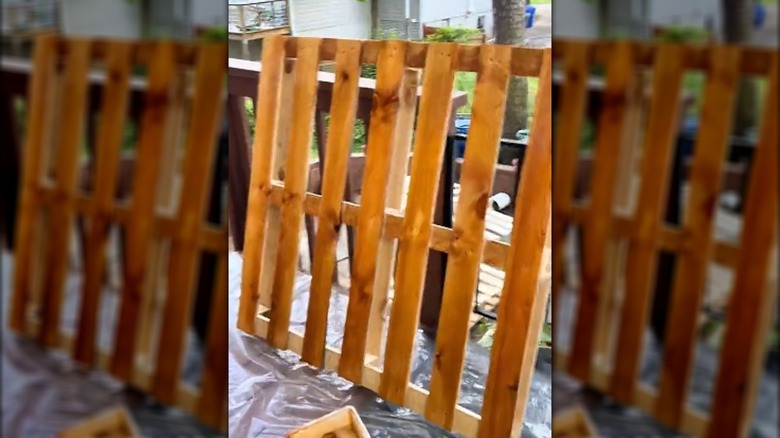 stained pallets being prepared for patio railing