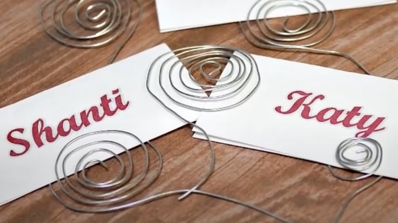 Wire spirals with name cards for table setting
