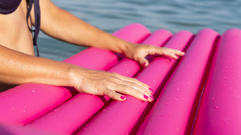 hands on pink pool float