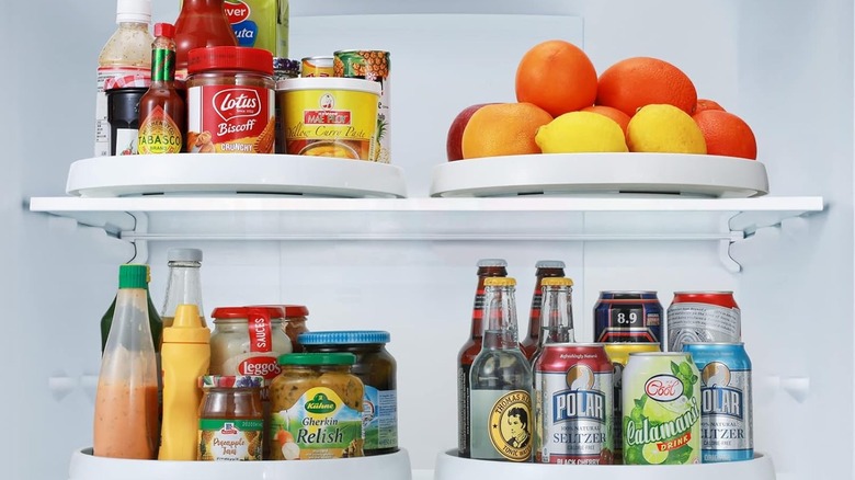 Lazy susan cabinet organizers filled with food and drinks