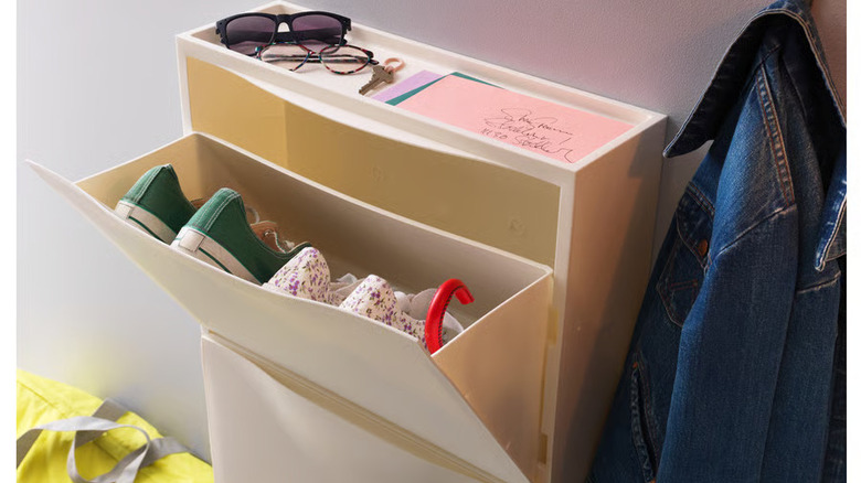 IKEA TRONES cabinet with shoes mounted on a wall