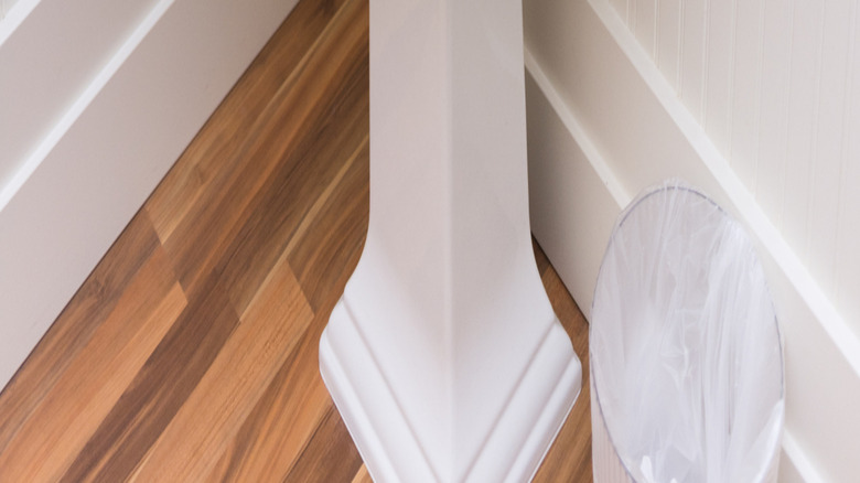 A simple white pedestal sink.